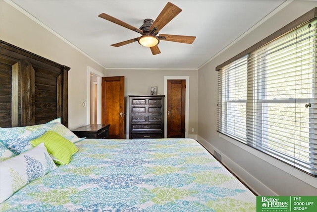 2028 N 55th St, Omaha, NE 68104 - bedroom featuring multiple windows, ornamental molding, baseboards, and ceiling fan