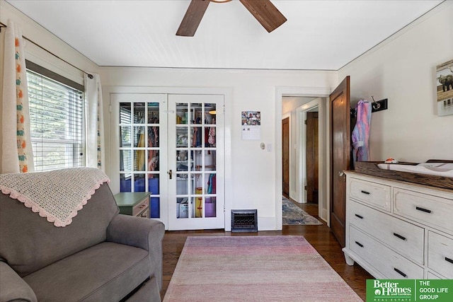 2028 N 55th St, Omaha, NE 68104 - living area with ceiling fan, french doors, and dark wood-style floors