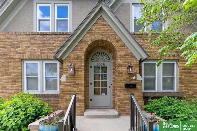 2028 N 55th St, Omaha, NE 68104 - view of exterior entry with brick siding and stucco siding