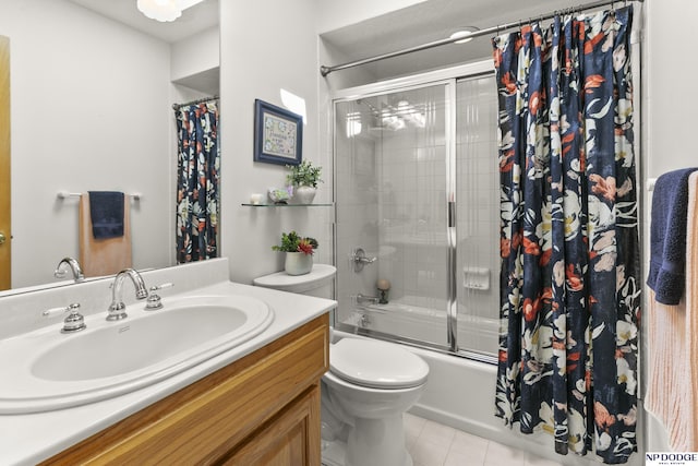 S-1196 N Lake Shore Dr, Fremont, NE 68025 - full bath featuring vanity, tile patterned floors, combined bath / shower with glass door, and toilet