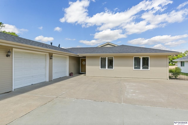 S-1196 N Lake Shore Dr, Fremont, NE 68025 - ranch-style house featuring driveway and an attached garage