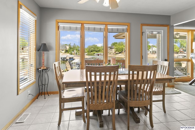 S-1196 N Lake Shore Dr, Fremont, NE 68025 - dining room featuring plenty of natural light, baseboards, and light tile patterned floors