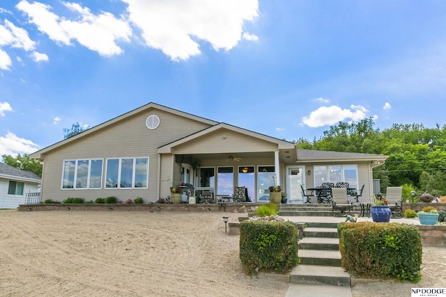 S-1196 N Lake Shore Dr, Fremont, NE 68025 - back of property with ceiling fan and a patio