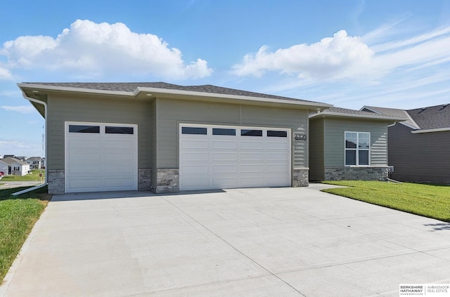 6320 Harvest Dr, Papillion, NE 68133 - view of front of property with stone siding, an attached garage, driveway, and a front yard