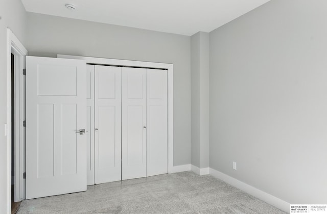 6320 Harvest Dr, Papillion, NE 68133 - unfurnished bedroom featuring carpet floors, baseboards, and a closet