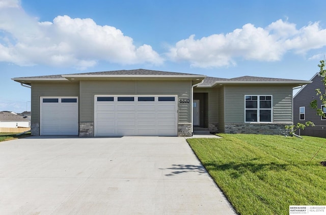 6320 Harvest Dr, Papillion, NE 68133 - prairie-style house with a garage, stone siding, driveway, and a front lawn