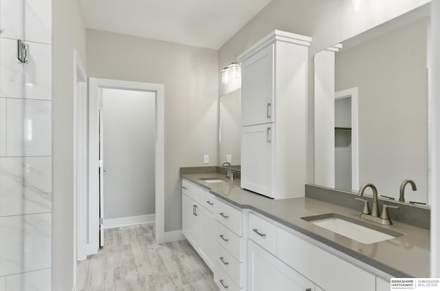 6320 Harvest Dr, Papillion, NE 68133 - bathroom featuring double vanity and baseboards