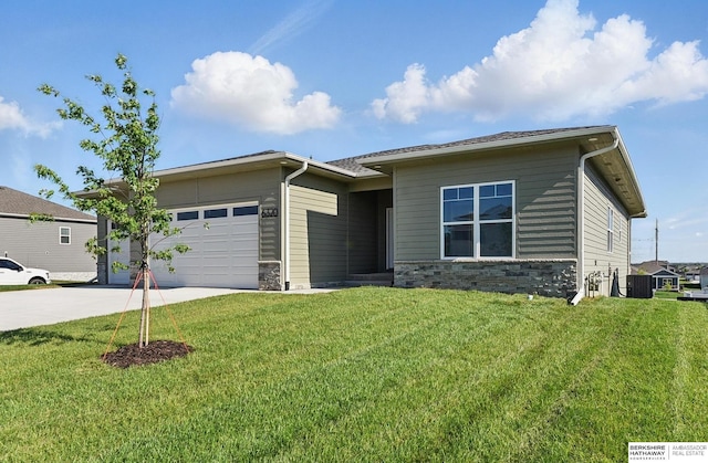6320 Harvest Dr, Papillion, NE 68133 - view of front of home with driveway, stone siding, a garage, cooling unit, and a front lawn