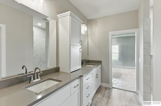 6320 Harvest Dr, Papillion, NE 68133 - full bathroom featuring double vanity, baseboards, wood finished floors, and recessed lighting