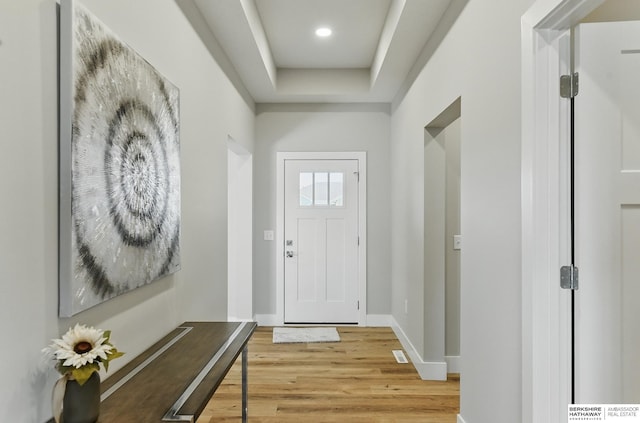 6320 Harvest Dr, Papillion, NE 68133 - foyer entrance with light wood-style flooring, baseboards, a tray ceiling, and recessed lighting