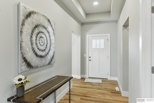 6320 Harvest Dr, Papillion, NE 68133 - foyer entrance featuring light wood-style floors, baseboards, and a tray ceiling