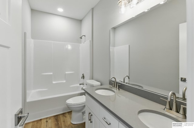 6320 Harvest Dr, Papillion, NE 68133 - full bathroom with double vanity, toilet, wood finished floors, and tub / shower combination
