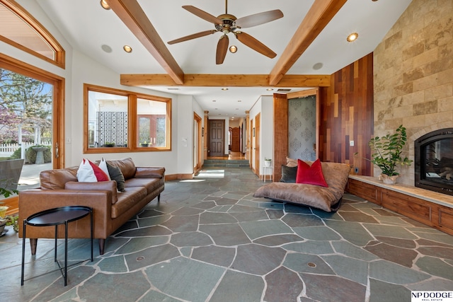 423 Fairacres Rd, Omaha, NE 68132 - living area with stone floors, healthy amount of natural light, ceiling fan, a fireplace, and recessed lighting