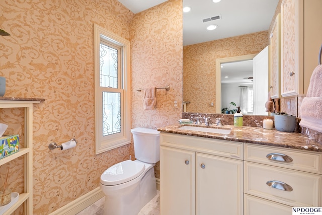 423 Fairacres Rd, Omaha, NE 68132 - bathroom featuring wallpapered walls, toilet, vanity, and recessed lighting