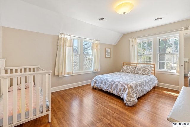 423 Fairacres Rd, Omaha, NE 68132 - bedroom with baseboards, wood finished floors, and lofted ceiling
