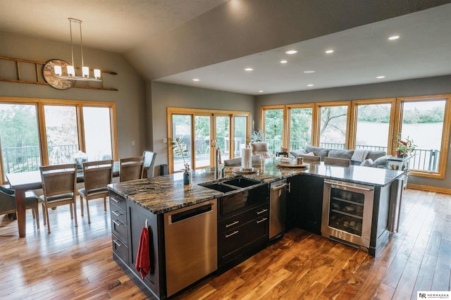 10955 N 58th Plz, Omaha, NE 68152 - kitchen featuring beverage cooler, dishwasher, open floor plan, a sink, and dark wood-style flooring