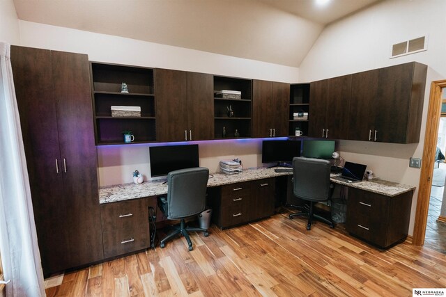10955 N 58th Plz, Omaha, NE 68152 - home office with built in desk, lofted ceiling, and light wood-style flooring