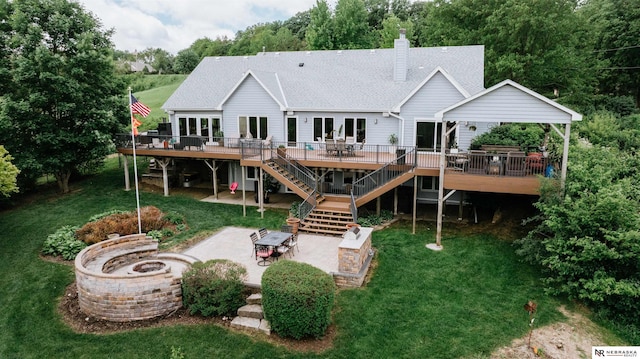 10955 N 58th Plz, Omaha, NE 68152 - rear view of house featuring a fire pit, stairs, a wooden deck, and a patio