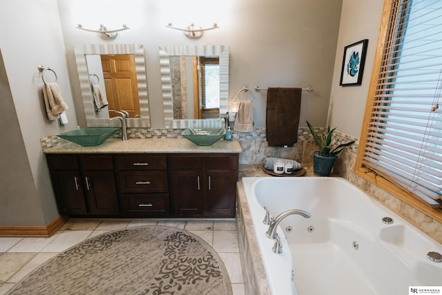 10955 N 58th Plz, Omaha, NE 68152 - full bath featuring double vanity, a tub with jets, and tile patterned floors