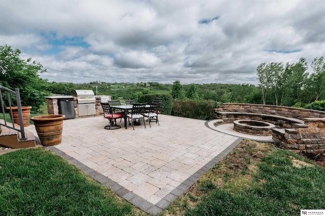 10955 N 58th Plz, Omaha, NE 68152 - view of patio / terrace featuring a fire pit and outdoor dining space