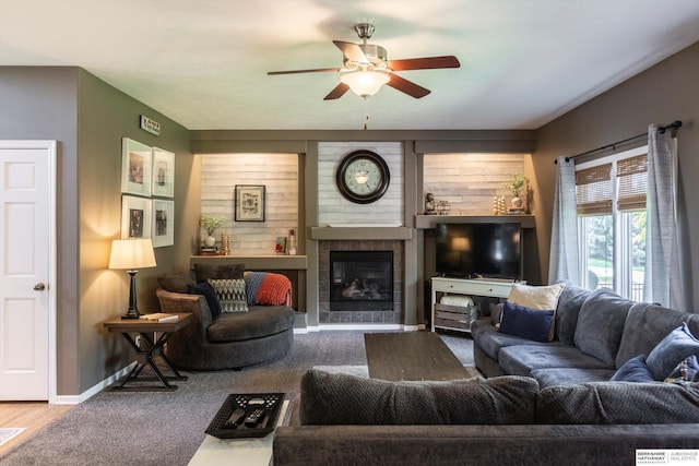 15210 Craig Cir, Bennington, NE 68007 - carpeted living area featuring ceiling fan, a tile fireplace, and baseboards