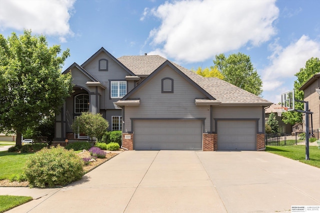 15210 Craig Cir, Bennington, NE 68007 - view of front facade with brick siding, an attached garage, driveway, and roof with shingles