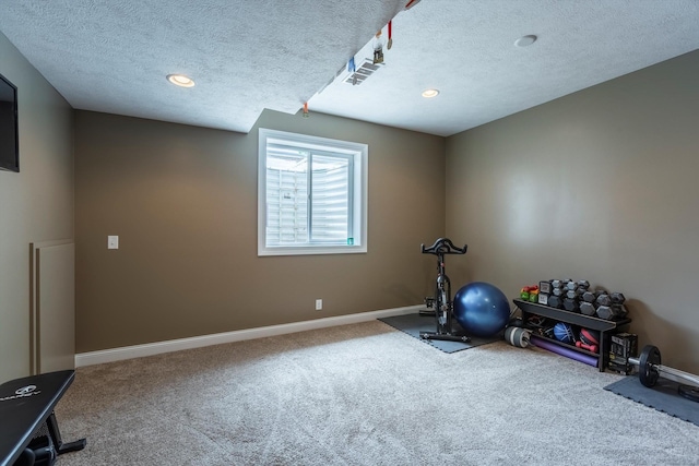 15210 Craig Cir, Bennington, NE 68007 - exercise room featuring carpet, baseboards, a textured ceiling, and recessed lighting