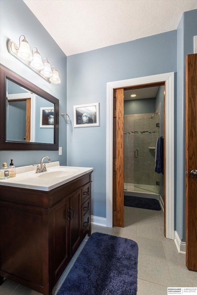 15210 Craig Cir, Bennington, NE 68007 - full bathroom with vanity, baseboards, and a shower stall