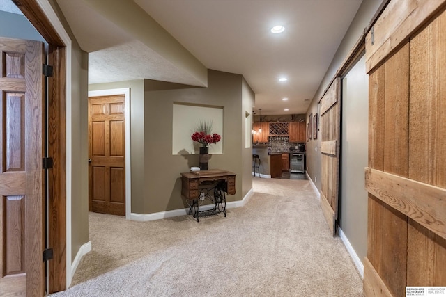 15210 Craig Cir, Bennington, NE 68007 - hall featuring light colored carpet, baseboards, recessed lighting, and beverage cooler