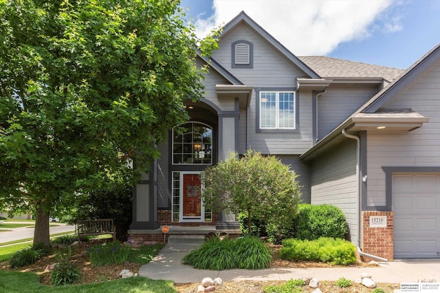 15210 Craig Cir, Bennington, NE 68007 - view of front facade featuring a garage