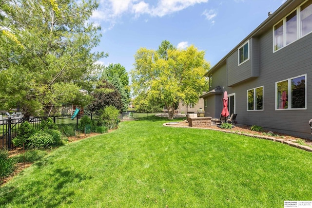 15210 Craig Cir, Bennington, NE 68007 - view of yard featuring a fire pit and a playground