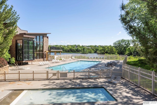 15210 Craig Cir, Bennington, NE 68007 - community pool featuring a patio and view of scattered trees