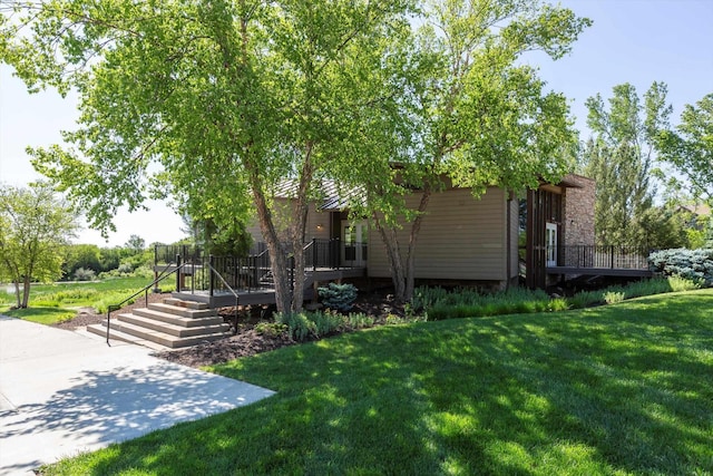 15210 Craig Cir, Bennington, NE 68007 - view of property exterior featuring a deck and a lawn