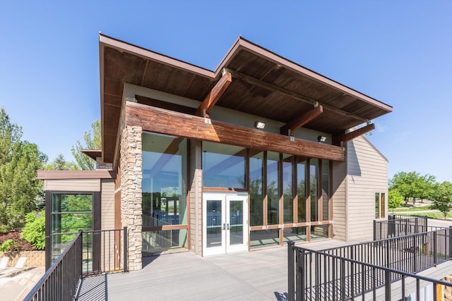 15210 Craig Cir, Bennington, NE 68007 - wooden terrace with french doors