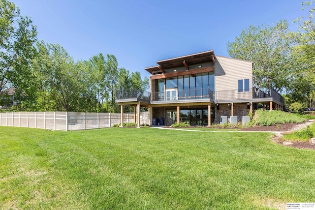 15210 Craig Cir, Bennington, NE 68007 - rear view of house featuring stone siding and a deck