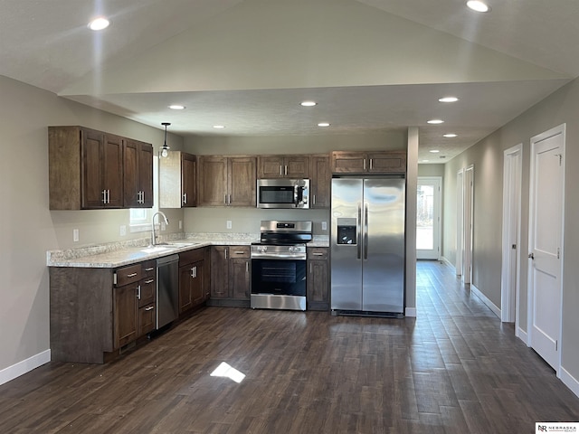 117 N Edna St, Valentine, NE 69201 - kitchen featuring stainless steel appliances, vaulted ceiling, baseboards, a sink, and dark wood-style flooring