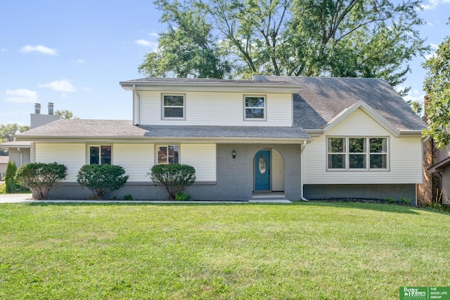 3501 Leawood Dr, Bellevue, NE 68123 - traditional-style house featuring a front yard, a shingled roof, and brick siding