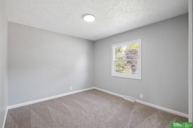 3501 Leawood Dr, Bellevue, NE 68123 - carpeted spare room featuring a textured ceiling and baseboards