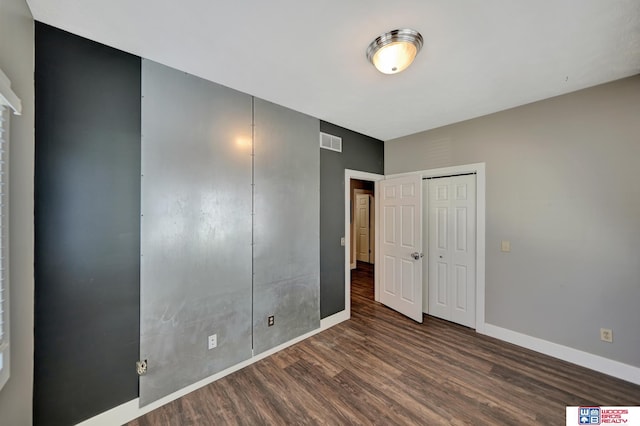 7627 S 38th St, Lincoln, NE 68516 - unfurnished bedroom featuring wood finished floors and baseboards