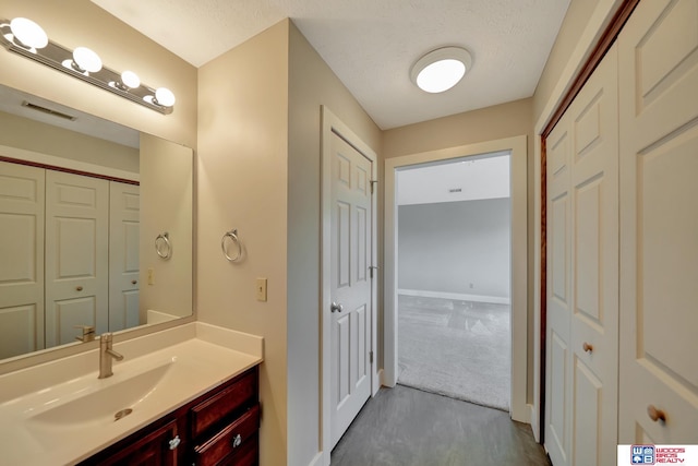 7627 S 38th St, Lincoln, NE 68516 - bathroom with vanity, baseboards, and a closet