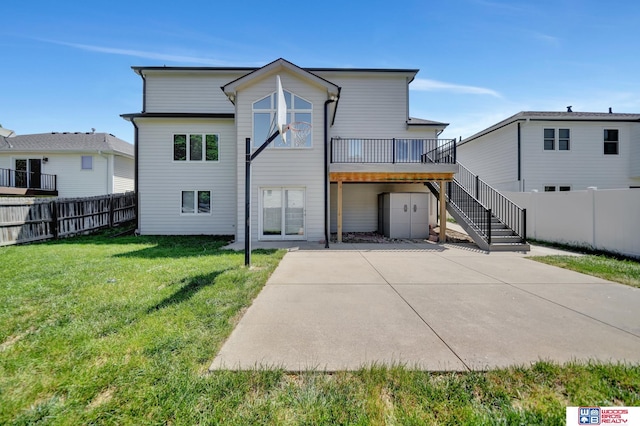 7627 S 38th St, Lincoln, NE 68516 - rear view of property with a patio, stairway, a wooden deck, and concrete driveway