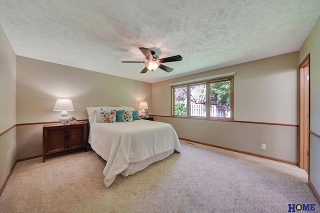 4801 S 72nd St, Lincoln, NE 68516 - bedroom with light colored carpet, baseboards, a textured ceiling, and ceiling fan
