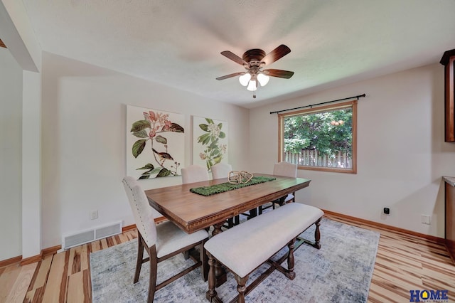 4801 S 72nd St, Lincoln, NE 68516 - dining room with ceiling fan, light wood finished floors, and baseboards