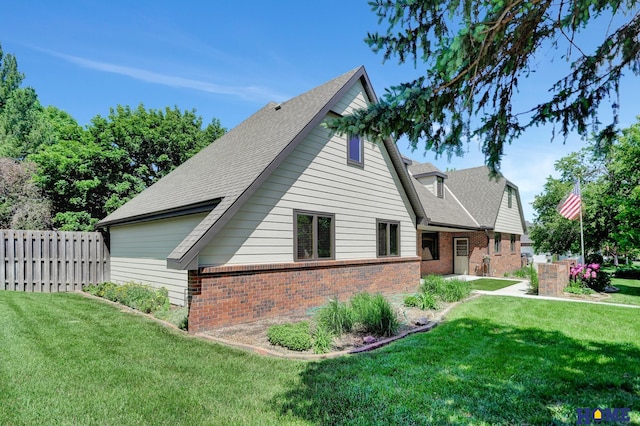 4801 S 72nd St, Lincoln, NE 68516 - view of property exterior featuring brick siding and a shingled roof