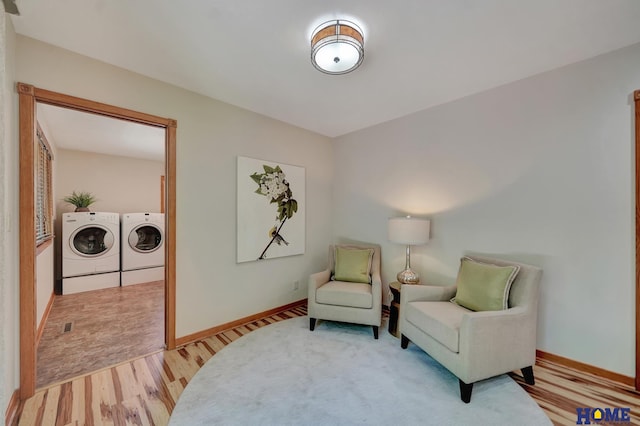 4801 S 72nd St, Lincoln, NE 68516 - sitting room featuring separate washer and dryer, light wood-style flooring, and baseboards