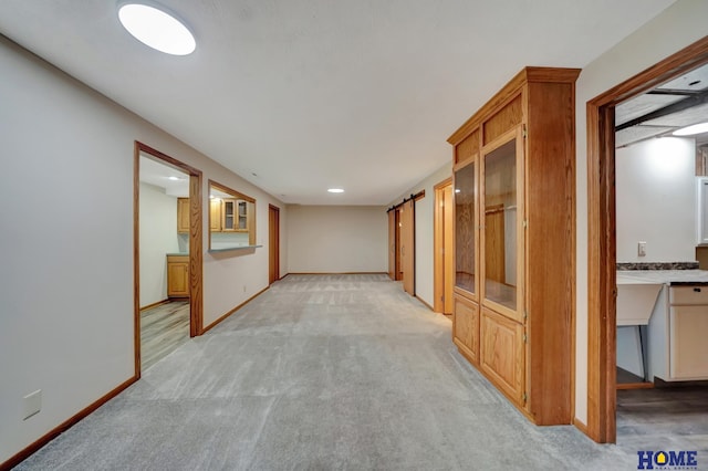 4801 S 72nd St, Lincoln, NE 68516 - corridor featuring light carpet, baseboards, and recessed lighting