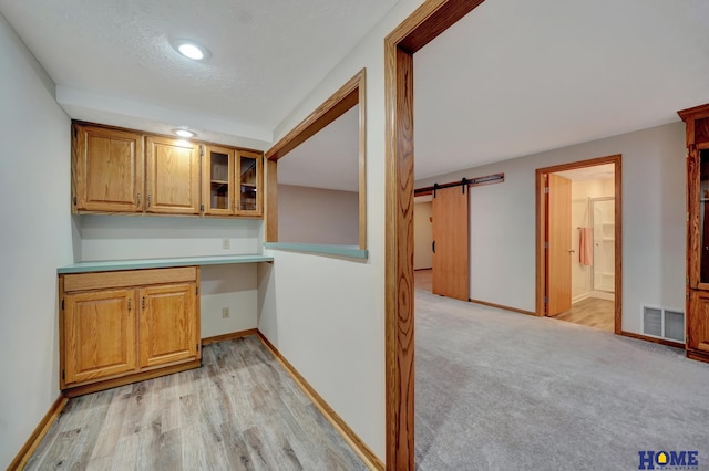 4801 S 72nd St, Lincoln, NE 68516 - bar area featuring a barn door, baseboards, light wood-style floors, and recessed lighting