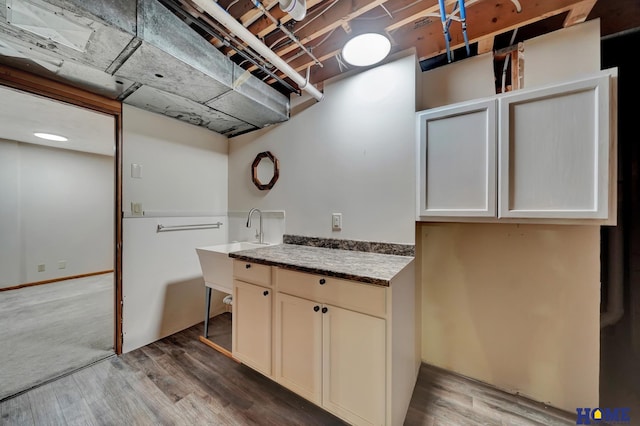 4801 S 72nd St, Lincoln, NE 68516 - laundry room featuring wood finished floors and a sink