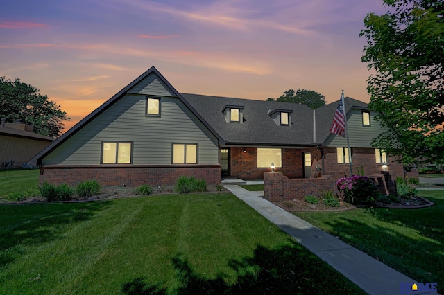 4801 S 72nd St, Lincoln, NE 68516 - view of front of house featuring brick siding and a front yard
