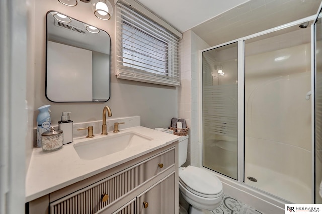 6844 Laurent Cir, Lincoln, NE 68526 - bathroom featuring a shower stall, toilet, and vanity